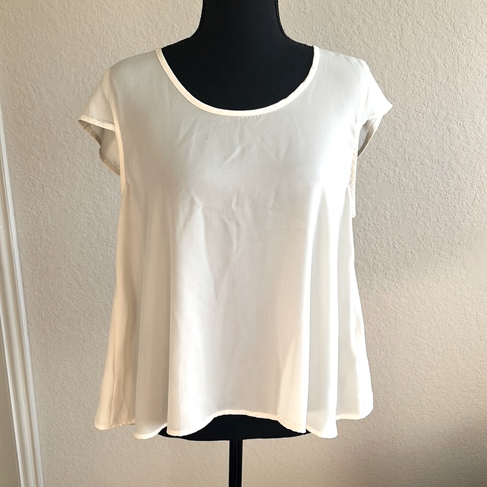 Cream Elodie Blouse. A bit translucent. Teen size.